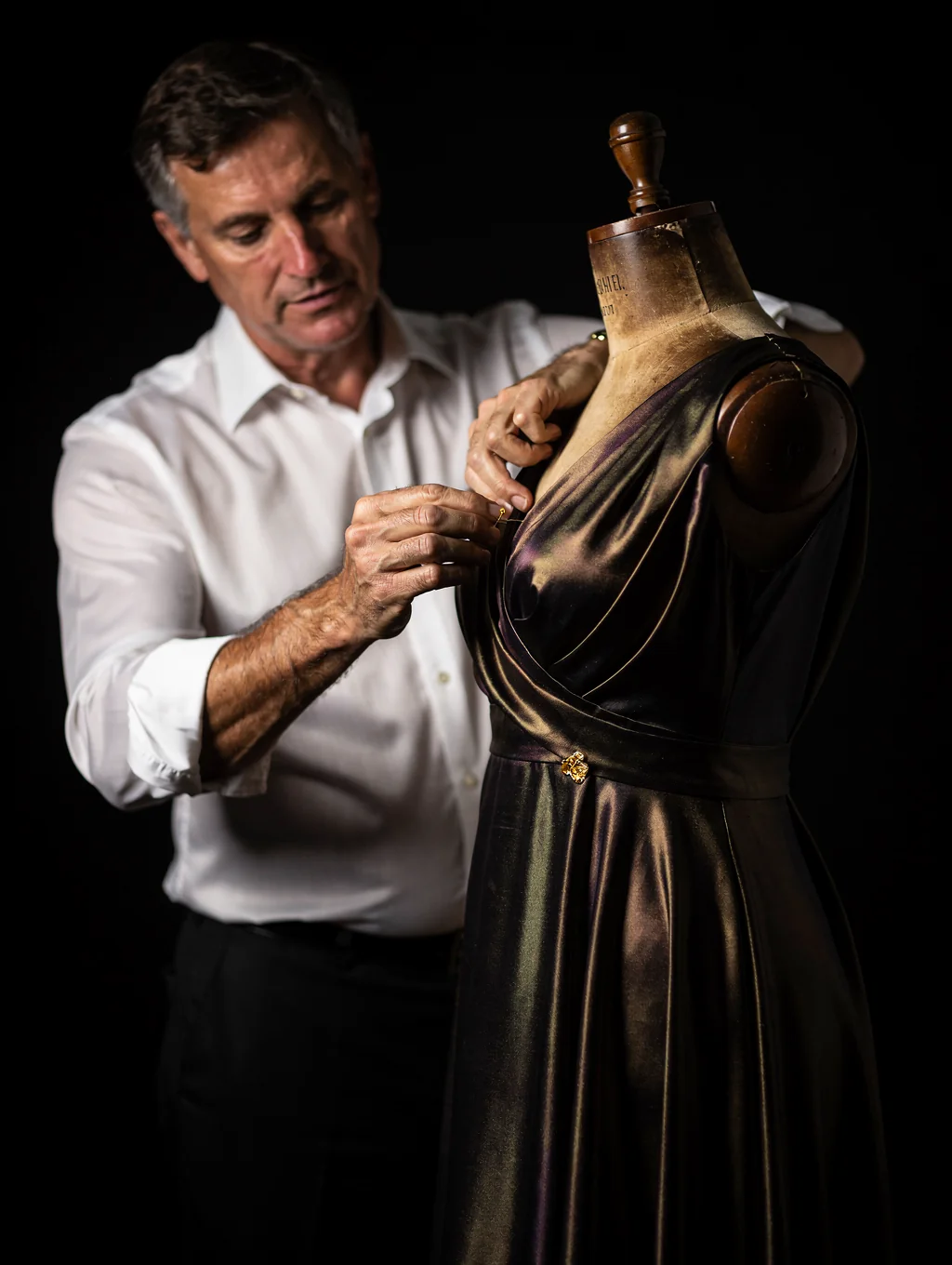 Bespoke dressmaker draping silk in the Our Dealers Choice atelier